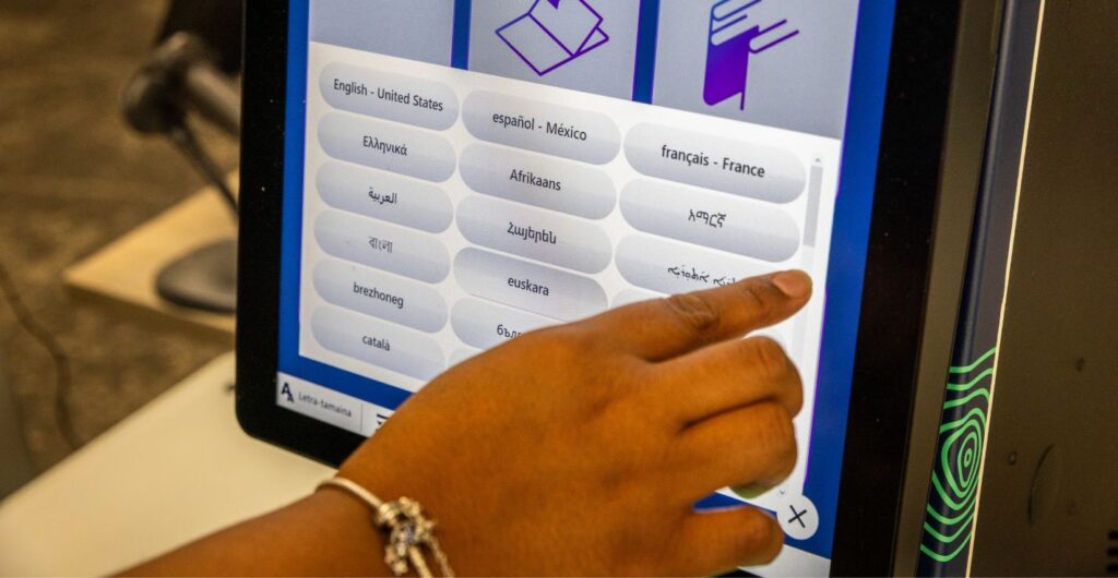 library patron selecting a language on the quickConnect™ interface, which supports 74 languages to enhance accessibility for diverse communities.